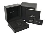 a black box with a watch inside of it on a white background