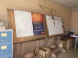 a picture of a room with a bunch of papers on the wall