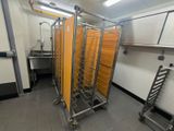 a room with a bunch of racks of food in it