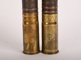 pair of antique brass and wood salt and pepper shakers on a white background