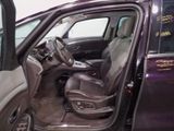 a purple car with the door open and the driver ' s seat down