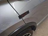 a close up of a car door with a sticker on it
