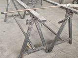a man that is working on a table in a factory