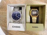 two watches in a box on a table
