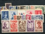 a group of stamps with a picture of military men on them
