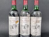three bottles of wine sitting next to each other on a table