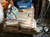 a pile of books and a bag sitting on top of a pile of boxes