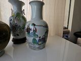 three vases that are sitting on a white table