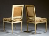 pair of chairs with upholstered back and upholstered seat