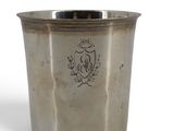 a silver cup with a coat of arms on it