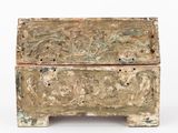 an old wooden box with carvings on it