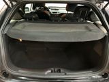 the back of a car with the trunk open and the seats down