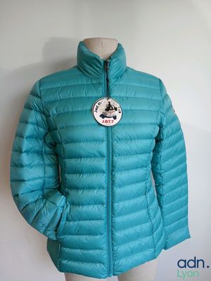 the jacket is blue and has a badge on it