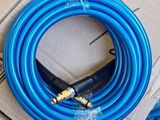 a blue hose that is sitting on top of a cardboard box