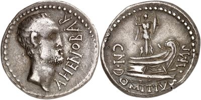a close up of a coin with a boat on it