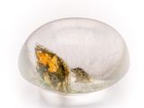 a glass object with a yellow leaf inside of it