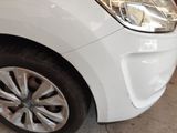 a white car that is parked in a garage