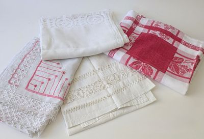 four different types of napkins on a white table