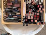a table with a lot of makeup on it