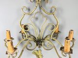 an image of a wall mounted candle holder with two candles