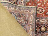 a close up of a rug on a carpet with a rug on the floor