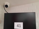 a picture of a television mounted on a wall in a bathroom