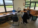 a room with a desk and a chair in it