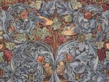 a close up of a tapestry with birds and flowers on it