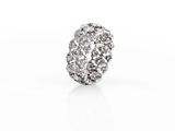 a close up of a diamond ring on a white surface