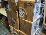 boxes stacked on top of each other on the floor in a living room