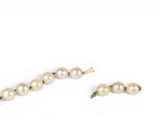 pearl necklace and earring set on a white background