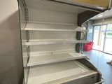 a empty display case in the middle of a store