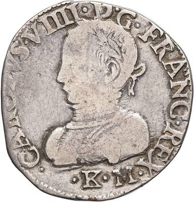 a close up of a silver coin with a man ' s face on it