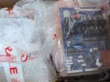 two bags of electronic equipment sitting on a table