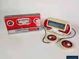 a small electronic device that is sitting in front of a box