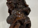 an image of a statue of a woman holding a child