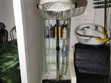 a hair dryer sitting on top of a stand in a room