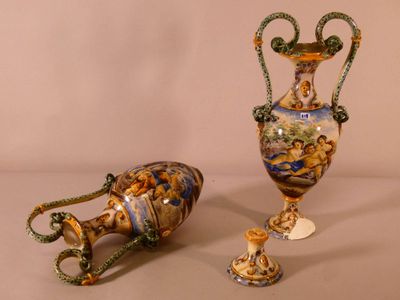 two vases sitting next to each other on a table