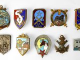 a lot of badges that are on a white surface