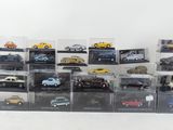 a lot of toy cars that are in a display case