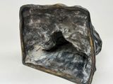 a sculpture of a rock in the shape of a square
