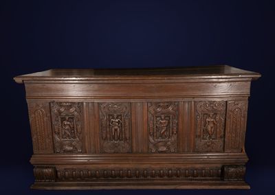 an old wooden chest with carvings and carvings on the sides