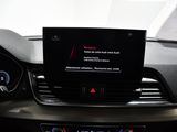 the dashboard of a car with a digital display on it