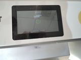 a picture of a tablet that is sitting on top of a stove