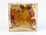 a glass block with a picture of a man and a woman inside of it