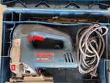 a box with a corded sander in it and a corded sander in it