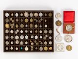 a box of coins and a box of coins on a white surface