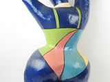 sculpture of a female torso made out of blue, green, yellow, and red paint