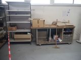 a room with shelves, shelves, and a broom in it