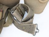 a belt and a bottle on a table